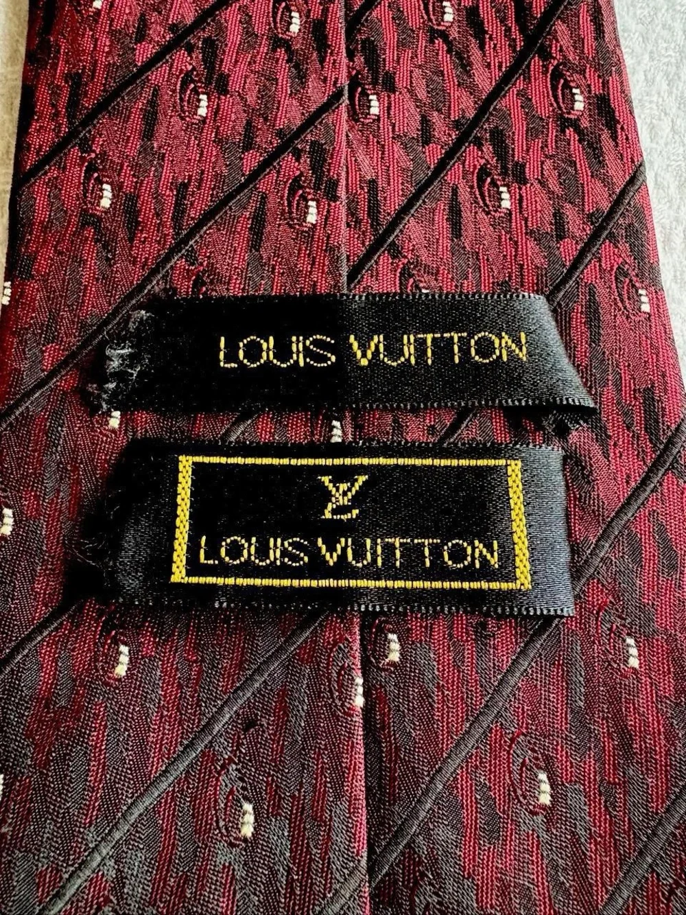Vintage Louis Vuitton burgundy tie with diagonal stripes and small white dots